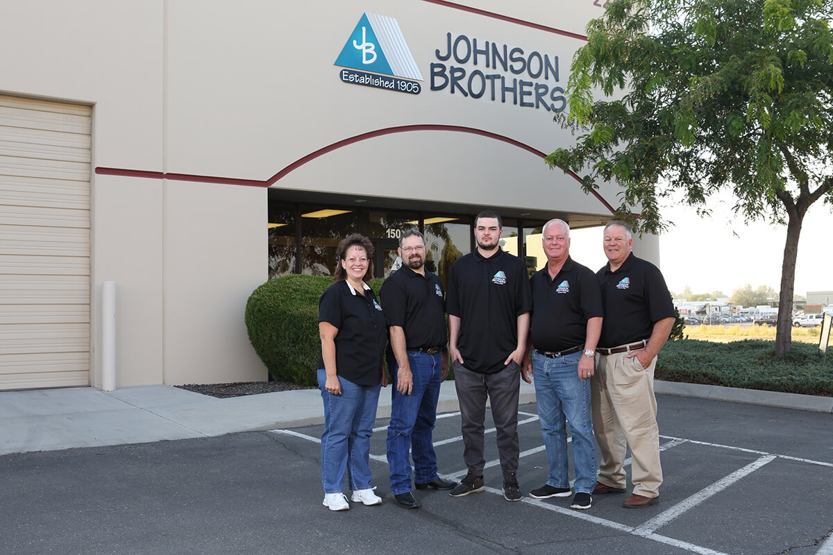 Small group image building behind store front team teamwork Boise Idaho photography